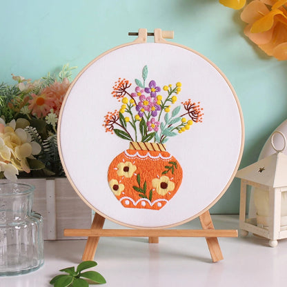 Autumn Glow captures the warmth and richness of the harvest season. The vibrant orange vase, filled with blooming yellow and purple flowers, radiates joy and coziness — a perfect reminder of golden afternoons and nature’s gentle abundance.