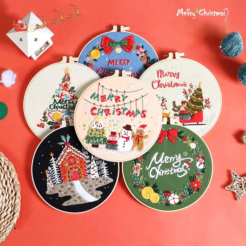Set of Christmas-themed embroidered hoop art on a red background
