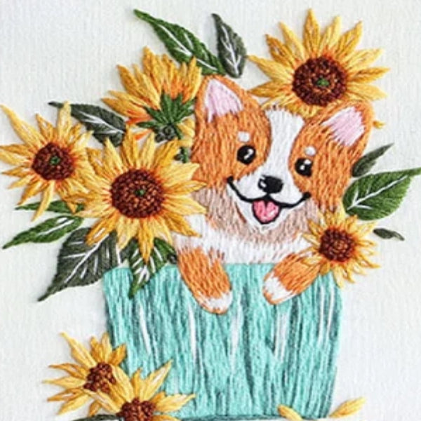 Embroidered design of a corgi with sunflowers on a white background