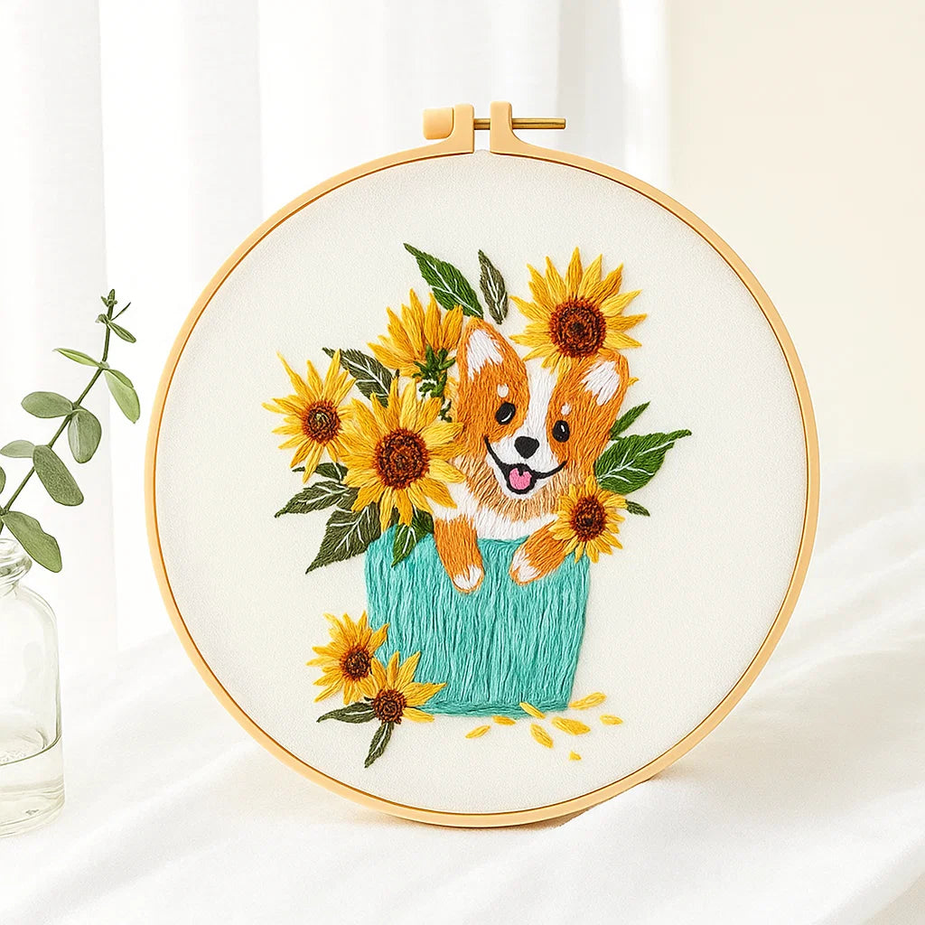 Embroidery hoop with a dog and sunflower design on a white background