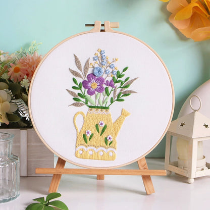 Golden Bloom captures the gentle warmth of sunlight pouring into a cozy room. The golden watering can, filled with delicate purple and blue blossoms, symbolizes care, growth, and everyday beauty — a reminder that love and nature thrive where they are tended.