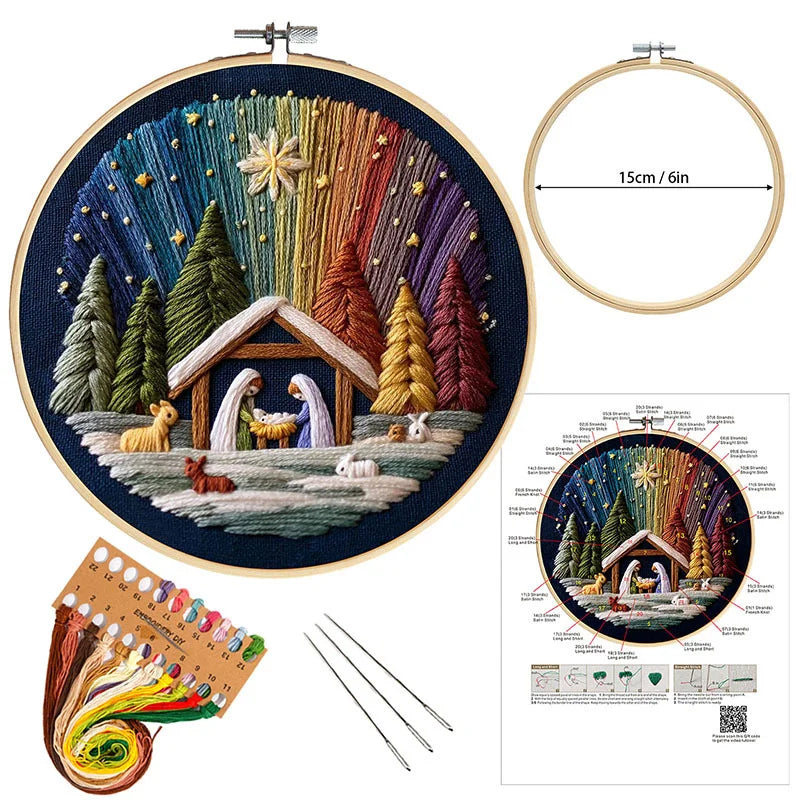 Embroidery hoop with a colorful nativity scene design, including an embroidery kit and instructions.