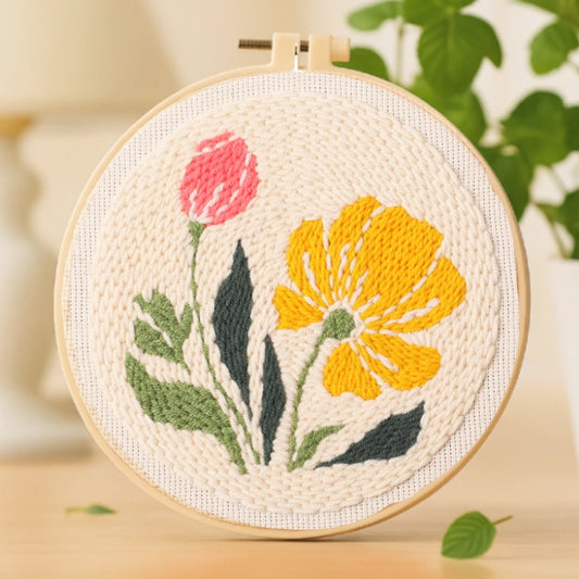 This punch needle artwork captures the gentle charm of spring with a golden flower and a tender pink bud swaying side by side. The warm yellow and soft green tones bring a sense of brightness and hope, making it a perfect piece to refresh your space or gift to someone special.